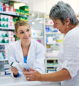 pharmacist at guardian pharmacy gorokan helping customer select medication