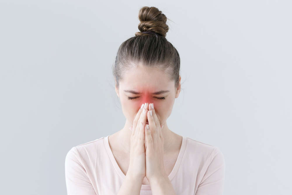 Close-up Of Young Female With Sinusitis